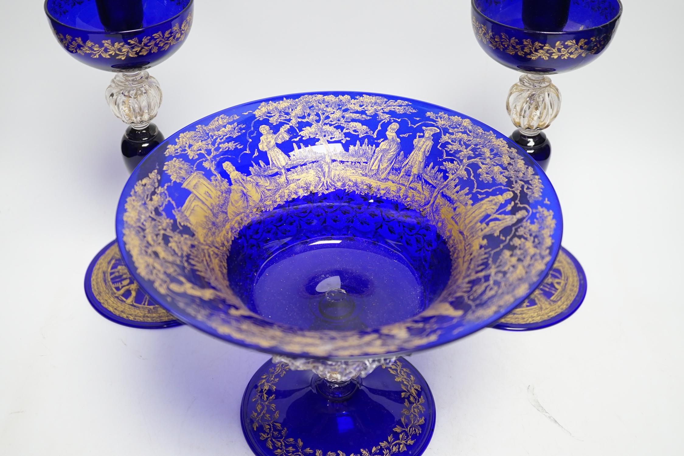 A Venetian gilded glass pedestal dish and a pair of candle holders, 26cm